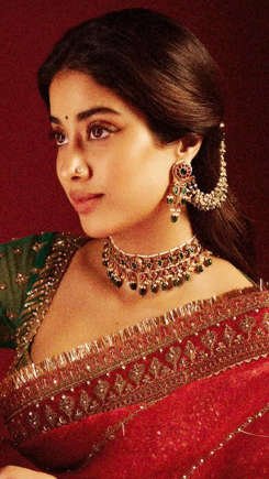 Janhvi Kapoor Exudes Grace and Royalty in a Red Hand-Embroidered Saree with a Green Blouse